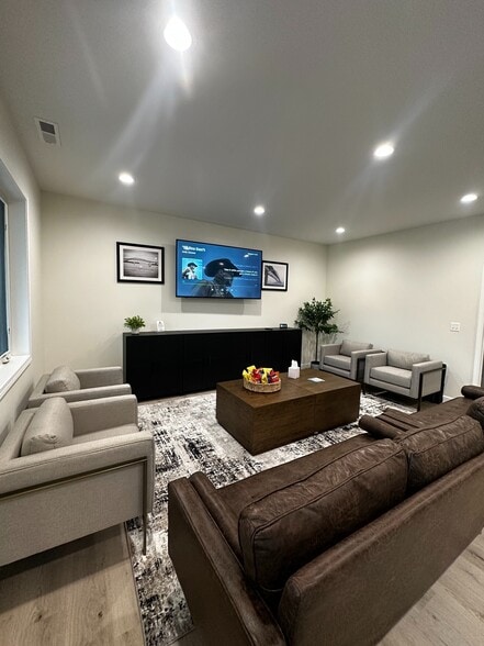 Meet, relax, or work in style—our beautifully appointed clubhouse offers a cozy, communal space for residents to gather, socialize, or unwind. - Westmoore Apartments