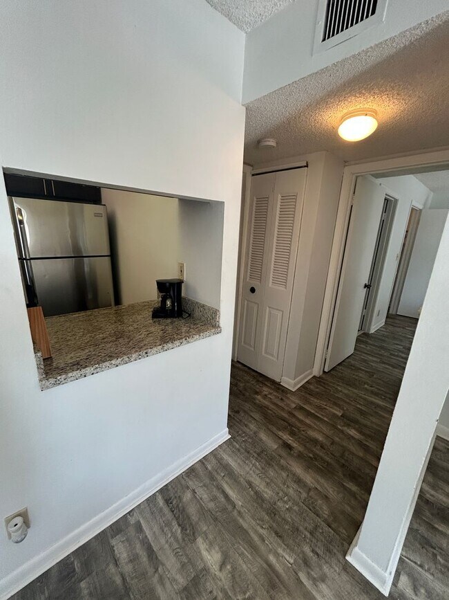 Building Photo - Now Leasing: 1-bedroom and 1.5 bath condo ...