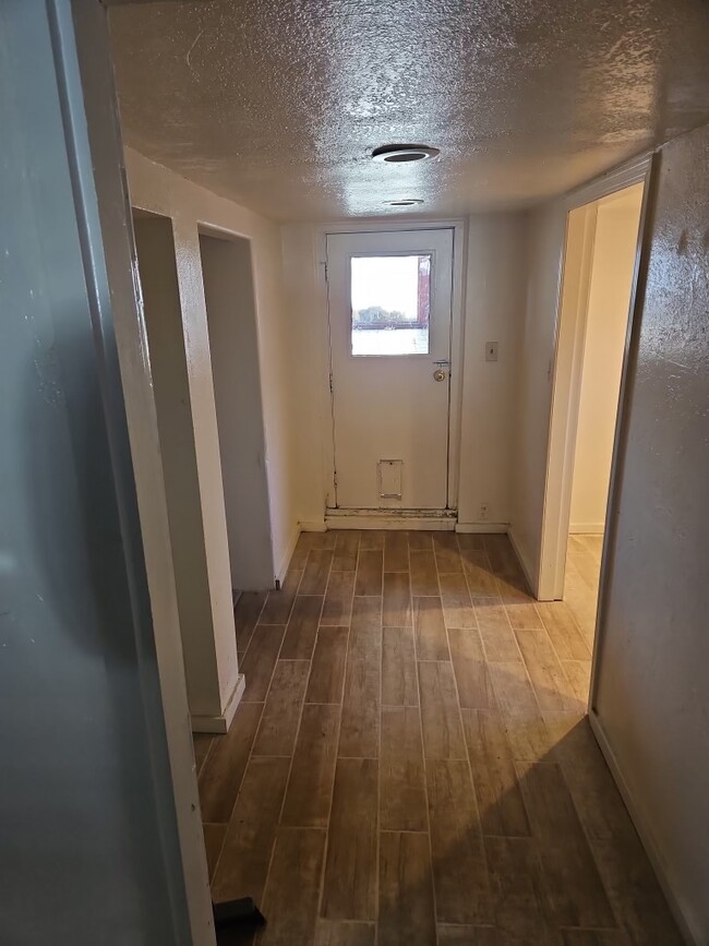 Entry hallway....bonus office room/closet on right bedroom on left - 130 Martin St