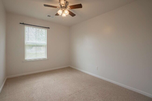 Building Photo - Partially furnished and now available!