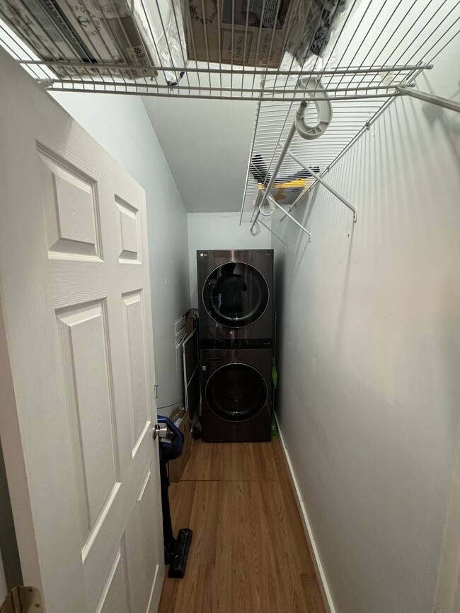 Laundry room with new stackable washer. - 21 Wallis Ave