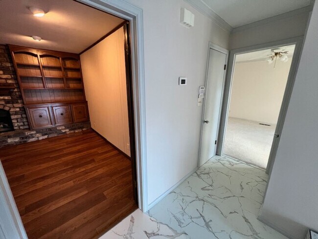 Building Photo - Step into this inviting, sunlit home where space and comfort blend seamlessly