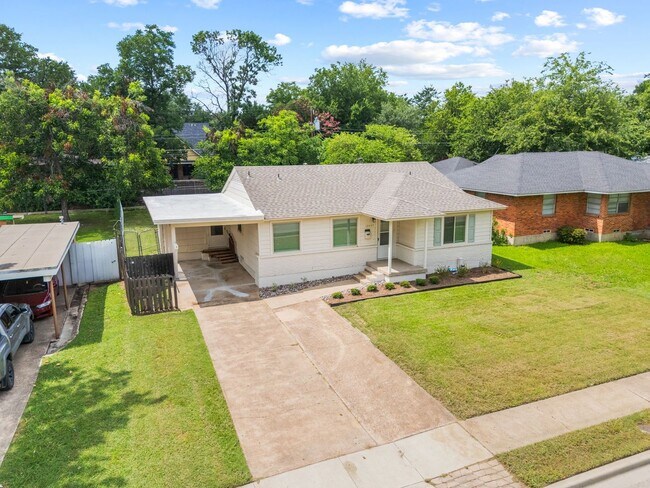 Building Photo - **$40K+ IN UPGRADES AND A FENCED BACKYARD WITH TWO STORAGE BUILDINGS**