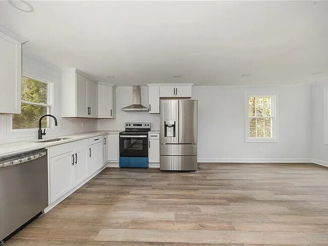 Building Photo - Earn Wealth While Leasing - Like a Homeown...