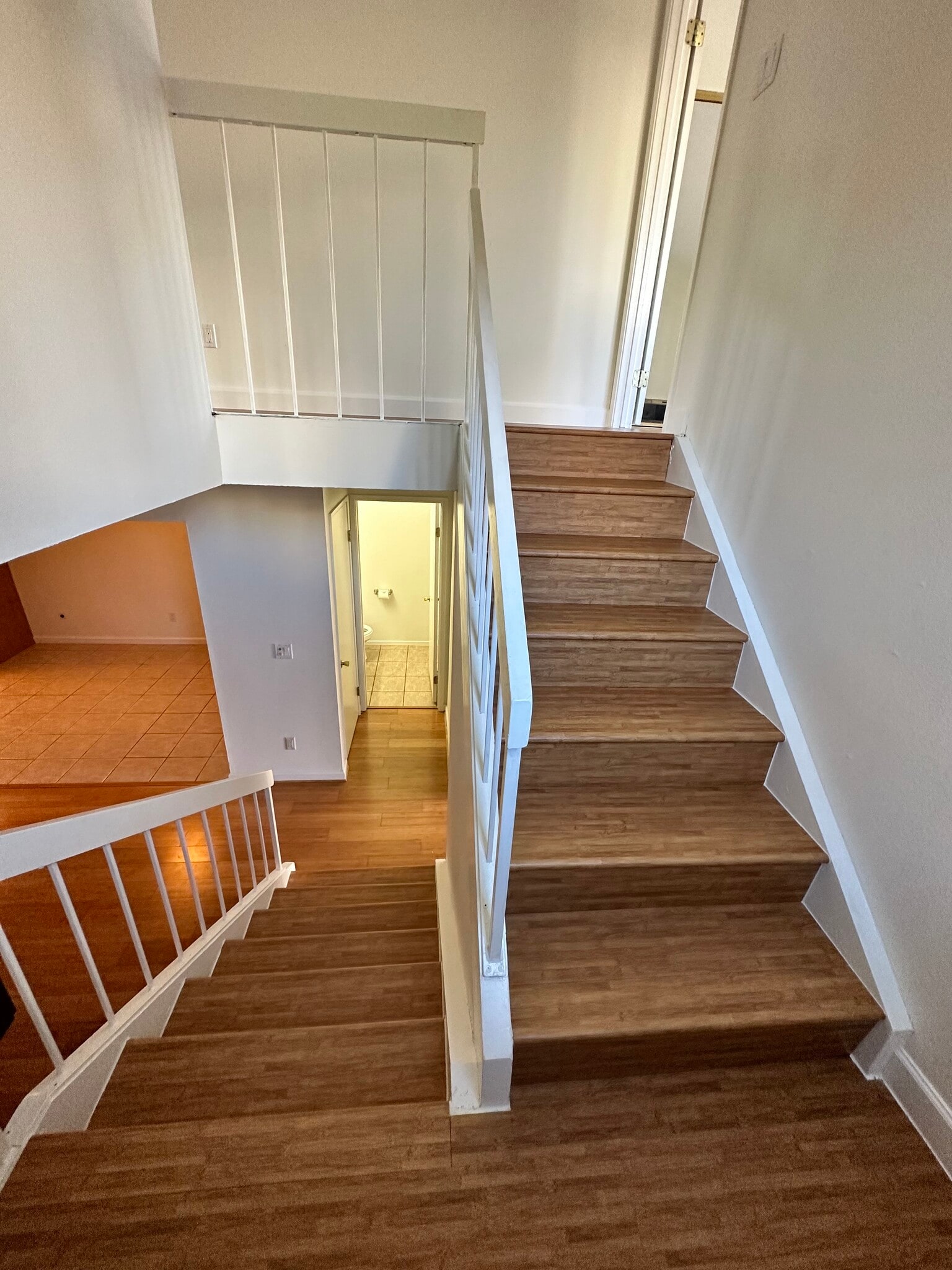 There is a tree that turns pink in the spring that can be seen from window of the stairs landing. - 9505 Easter Way