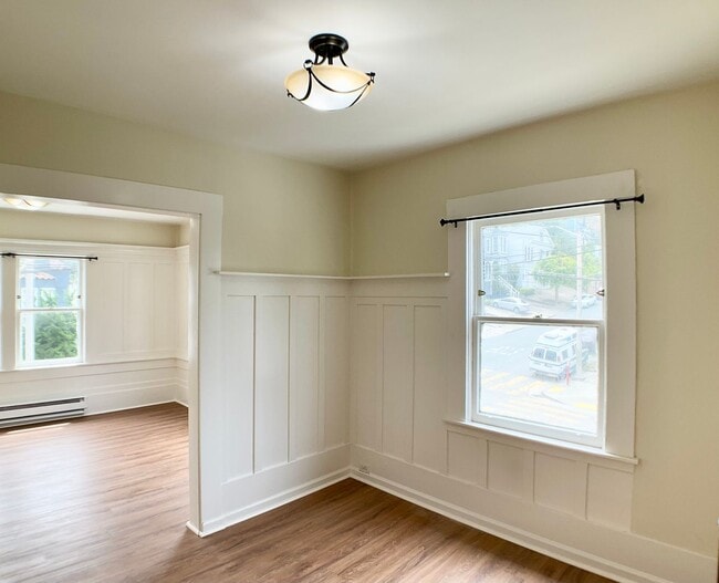 Building Photo - TOP FLOOR, Corner Studio. Hardwood Floors!...