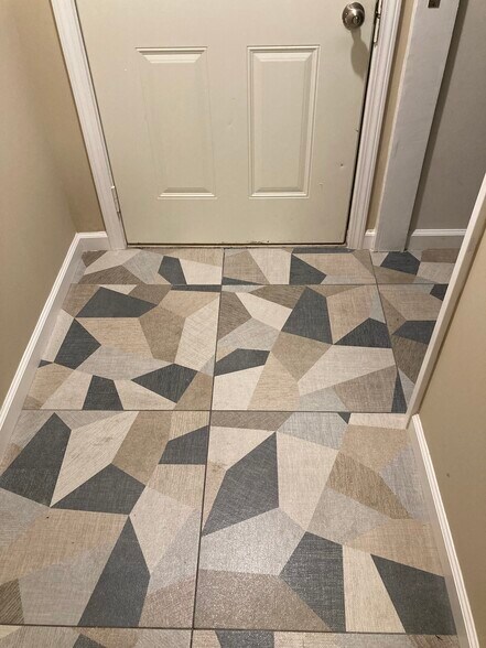 Ceramic tile floor in downstairs full bath - 1417 N Hamilton Ave