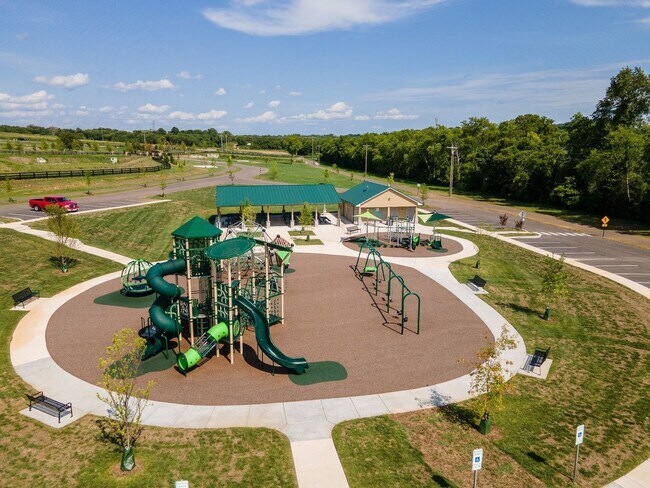 Building Photo - **BE THE LUCKY ONE TO LIVE IN THIS 2024-BUILT END-UNIT TOWNHOME IN A RESORT-STYLE COMMUNITY**