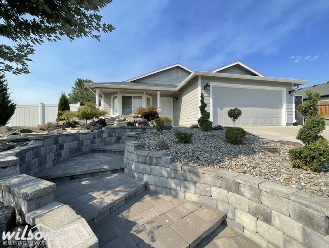 Building Photo - 3 Bed, 2 Bath Home with a Two-Car Garage, Fenced Backyard, and Lawn Care Included