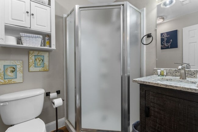 Building Photo - Welcome to Coastal Living at Harbor Landing Condominiums!