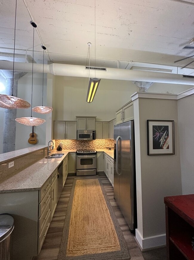 Building Photo - 1 BR/ 1BA at The Lofts with GATED GARAGE P...