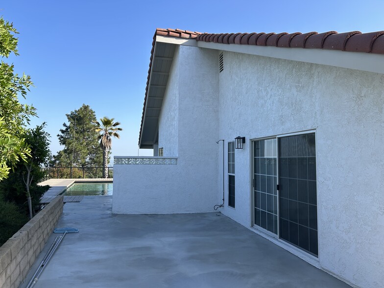 Back of Home with Outdoor Shower - 12644 Nola Pl
