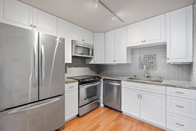 Building Photo - Available now! Updated Versailles Condo in Newport Beach