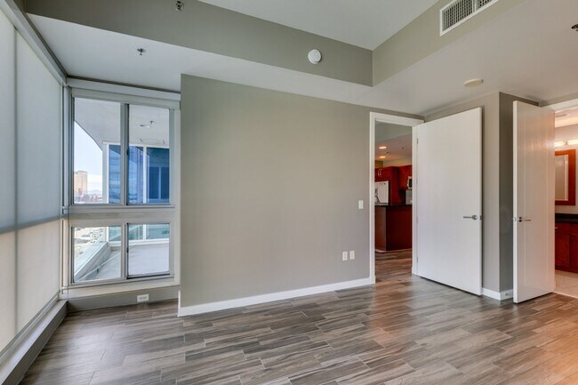 Building Photo - Iconic Strip-View Luxury | Elegant 1BR + Den High-Rise Residence