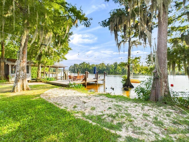 Building Photo - Private Furnished Riverfront Estate with Dock & Guest Apartment
