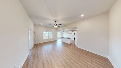 Building Photo - Open-Concept Home with Modern Upgrades Featuring Hardwood Flooring and Open Kitchen