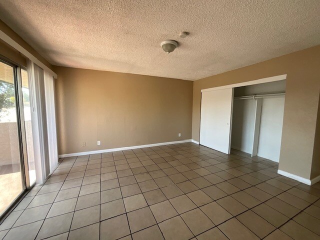 Tile flooring and slider to balcony - 101 E Olive Ave