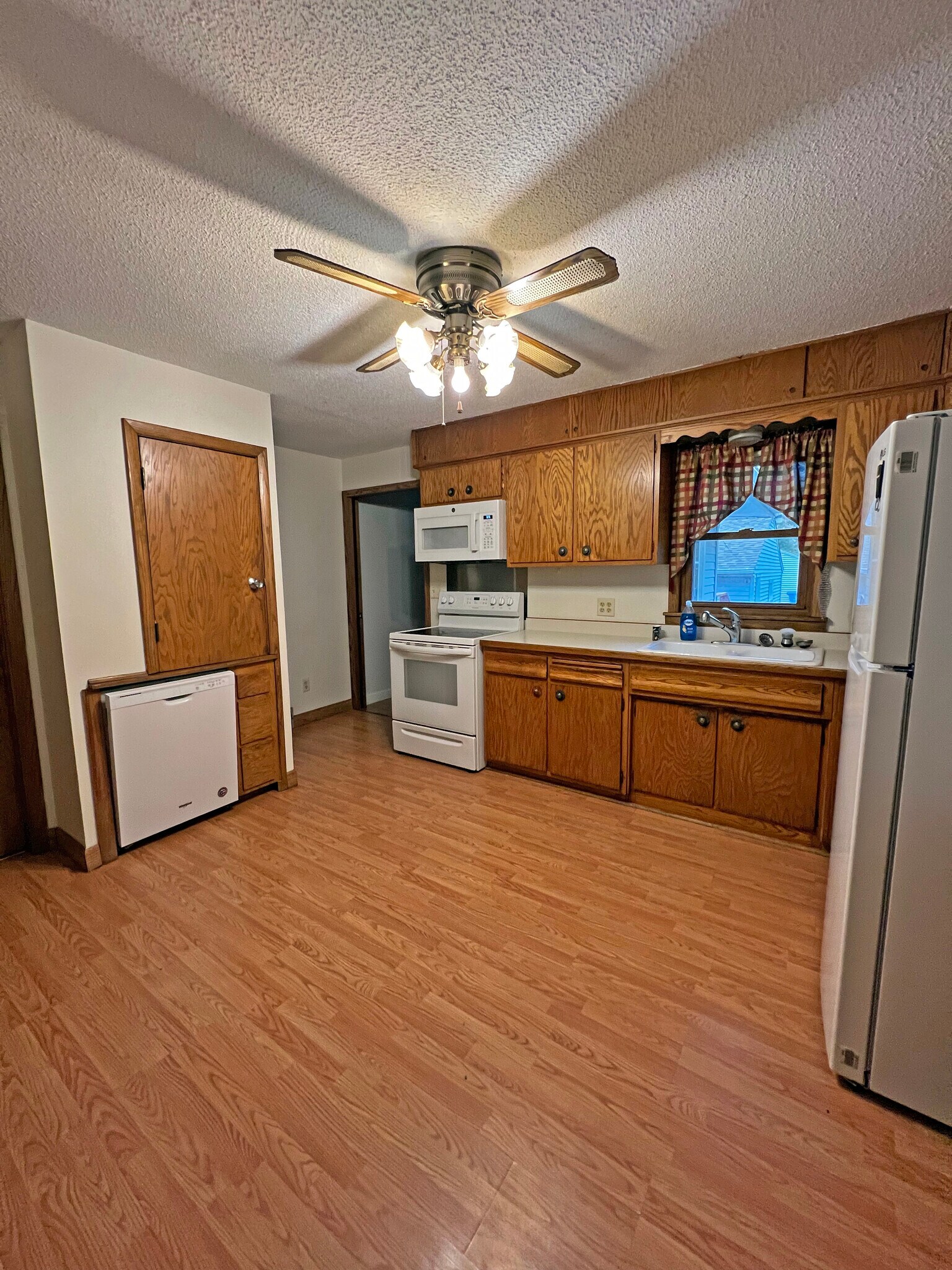 Kitchen with new dishwasher and microwave installed in 2021. - 1060 21st Ave SE
