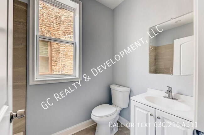 Building Photo - 6433 S Vernon Ave