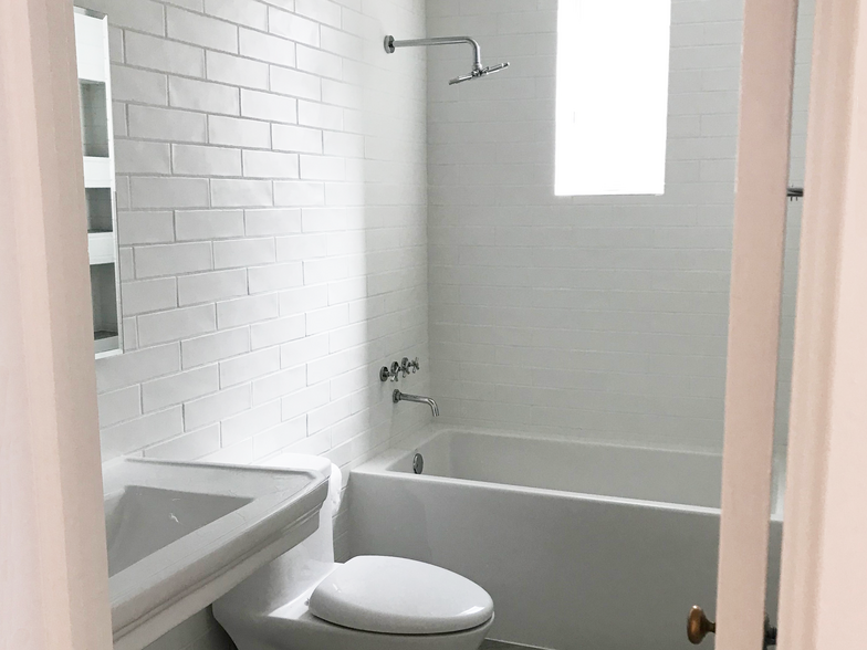 Bathroom with Surround Tile Walls - 308 Arno St NE