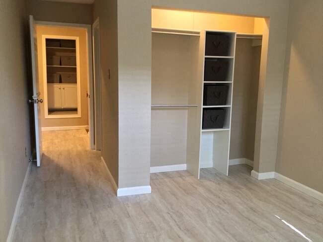 2nd bedroom closet with built in shelving and bin storage - 1103 Dulles Ave