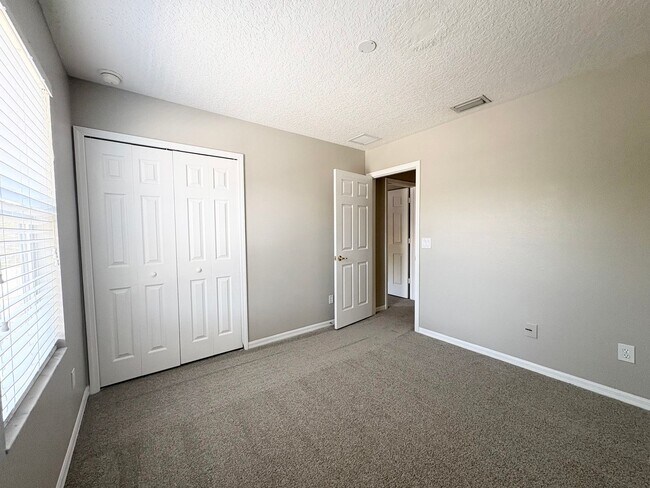 Building Photo - Gated 3B/2.5B Sanford Townhome ~ Fresh paint! ~ New flooring!