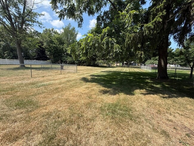 Building Photo - Spacious 4-Bedroom Home with Fenced Yard &...