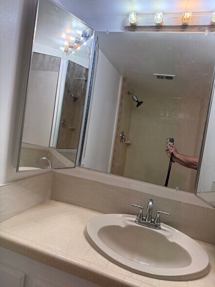 Master bathroom with large mirror/medicine cabinet’s - 349 E Thomas Rd