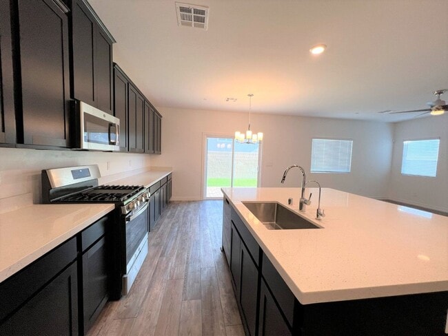 Building Photo - 4 BEDROOMS, 2.5 BATHS AT VILLIAGES AT TULE...