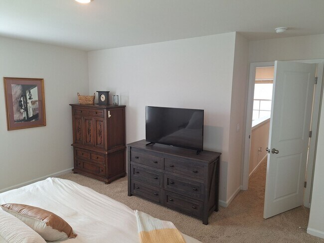 Building Photo - Lovely Four Bedroom Home  Appropriately 5 ...