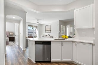 Select renovated apartments feature a modern kitchen with an open-concept floor plan - Windsor Main Place