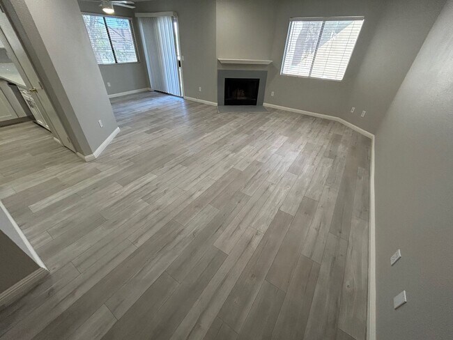 Building Photo - INVITING 2 BEDROOM TOP FLOOR CONDO IN A CE...