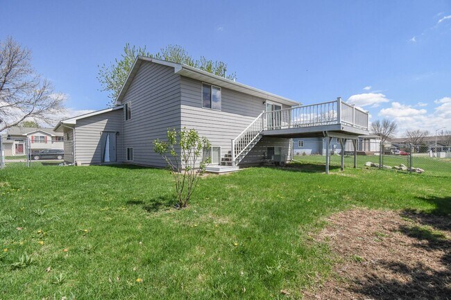Building Photo - Updated 3BR Split-Level Home with Huge Deck, Fenced Yard & 2-Car Garage Near I-29!