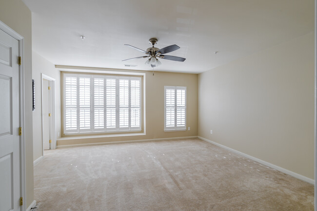 Spacious master bedroom with two large closets (one walk in closet) ceiling fan with remote, large windows with plantation shutters and flat screen HD TV included with rental. - 22785 Settlers Trail Terrace