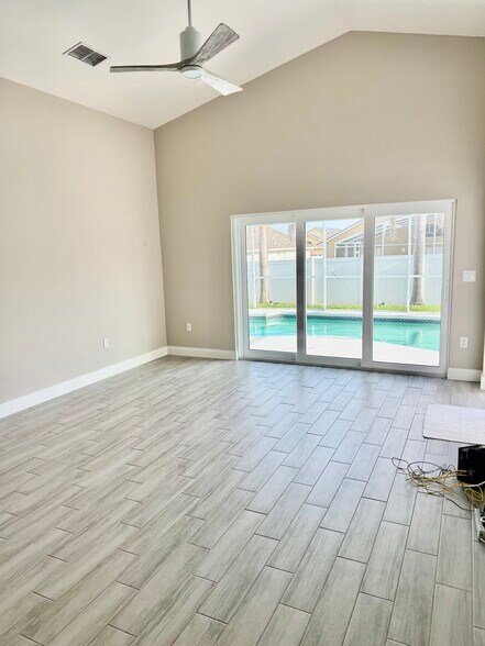 Huge Wall of Sliding Doors to Pool - 7902 Canary Palm Ct
