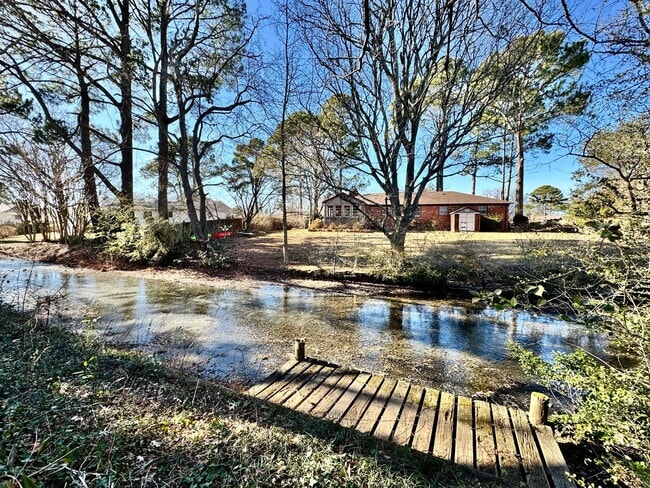 Building Photo - Available NOW! Lakefront 4 Bedroom/2 Bath Home, Pet-Friendly, Fenced Yard, Great School Zones!