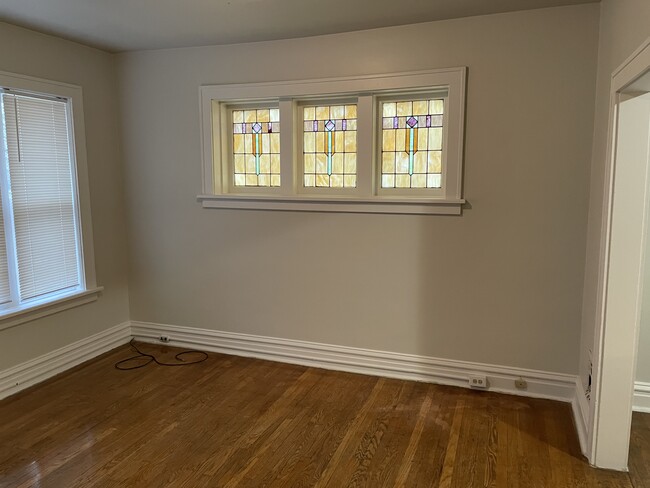 As you enter from front hall into the living room. Stain glass and low-e windows - 5033 Devonshire Ave