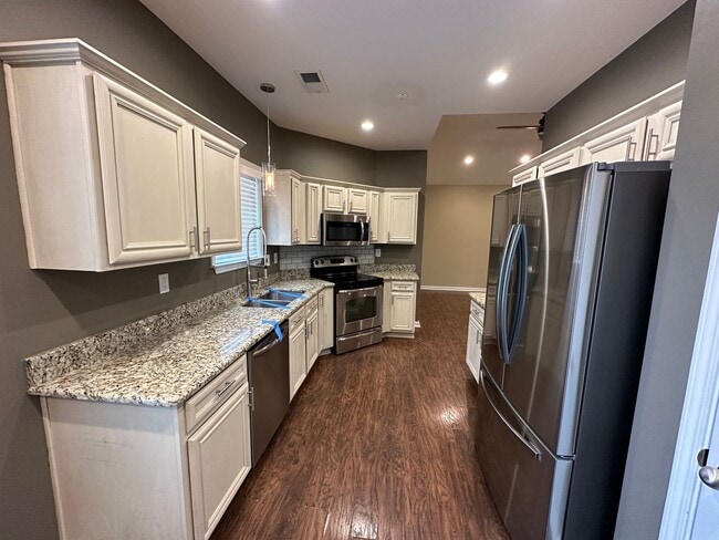 Building Photo - Updated 3 bd 2 bath with large fenced yard.  Pets are allowed!