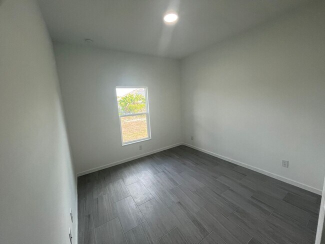 Building Photo - Brand-New 4BR/2BA Luxury Home with 2-Car Garage – Desirable 33971 Location