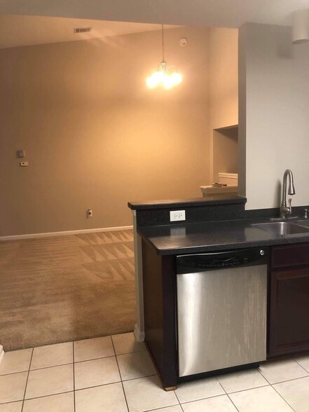 Kitchen out to dining area - 13800 Herons Landing Way