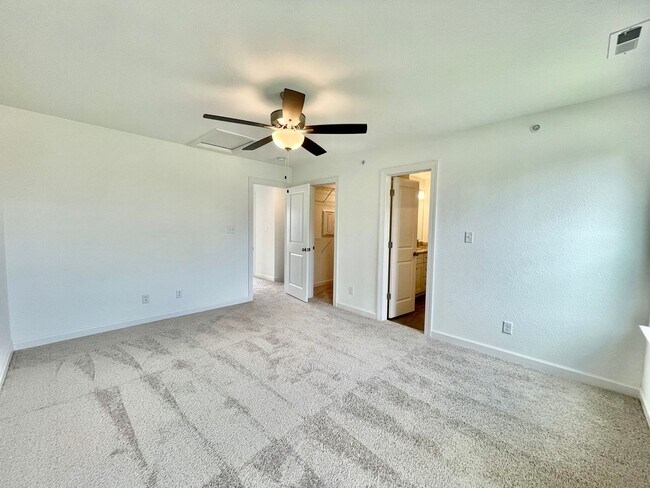 Building Photo - Practically New & Available NOW! Americana Luxury Townhomes! Pet Friendly! Attached Garage! All A...