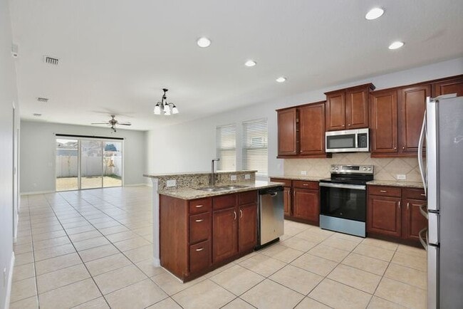 Building Photo - Stylish, Updated 3/2 Home in One of Millennia Park’s Gated Communities! Available Now!