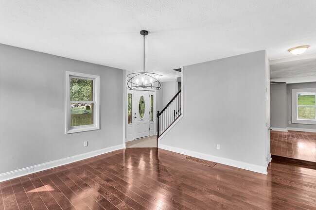 The large dining room is located on the opposite side of the stairs from the living room - 2416 Magee Road Ext