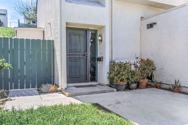 Building Photo - ***MOVE IN SPECIAL*** Modern 3BR Townhome | Garage + Driveway Parking | Yard | Pool | Pet Friendl...