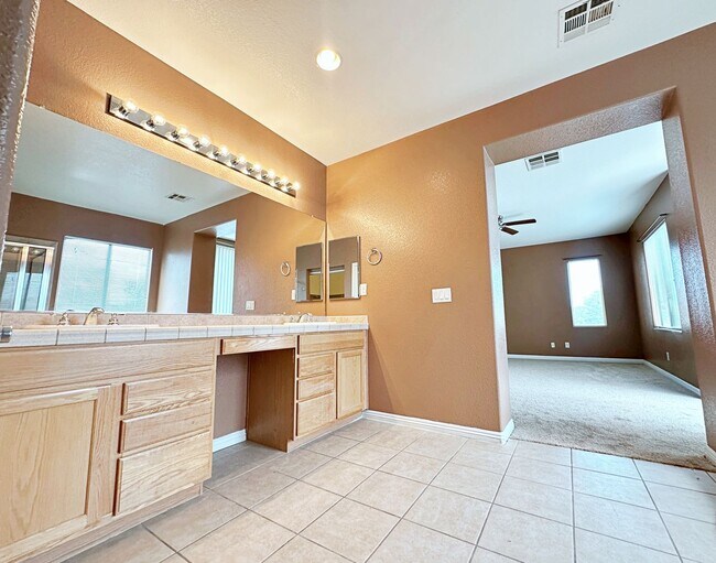 Building Photo - 4 BEDROOM HOME 3 CAR GARAGE ON A CORNER LO...