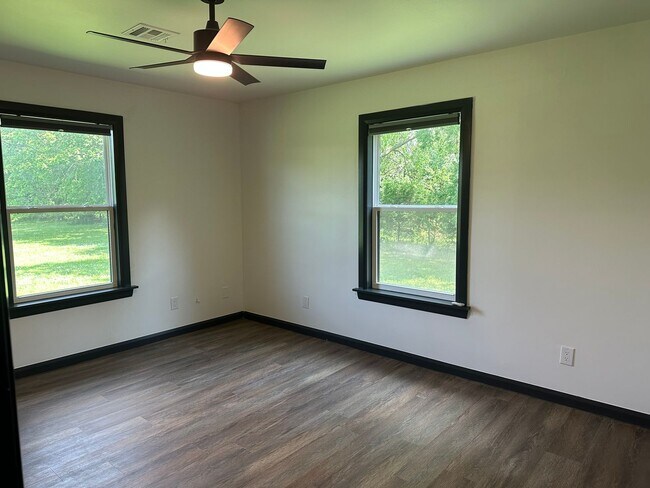 Building Photo - Welcome to country living with a fresh, modern twist.