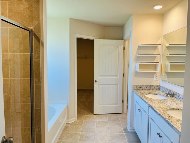 Building Photo - WOW! 5 bedrooms, 4.5 baths with a guest be...