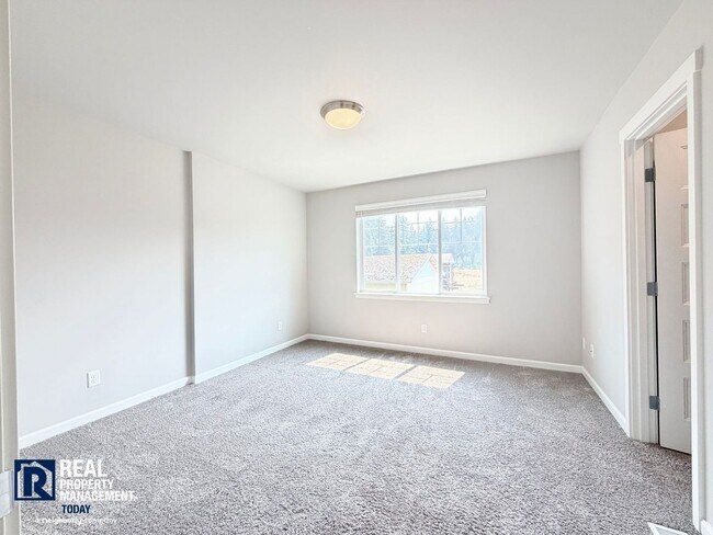 Building Photo - Easy JBLM Commute Like-New 4BR Home with 3-Car Garage & Bonus Office