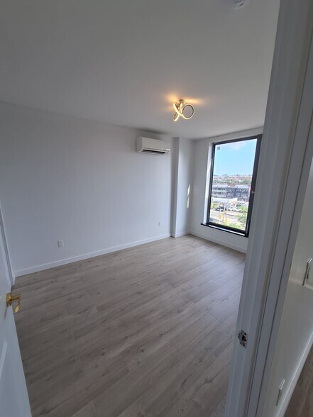 Bedroom with a big window - 7065 Queens Blvd