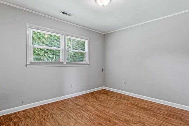 Building Photo - NE – Desirable Neighborhood, Brick Home, Wood/Laminate Flooring, Vaulted Ceilings, Carport, Fenced!